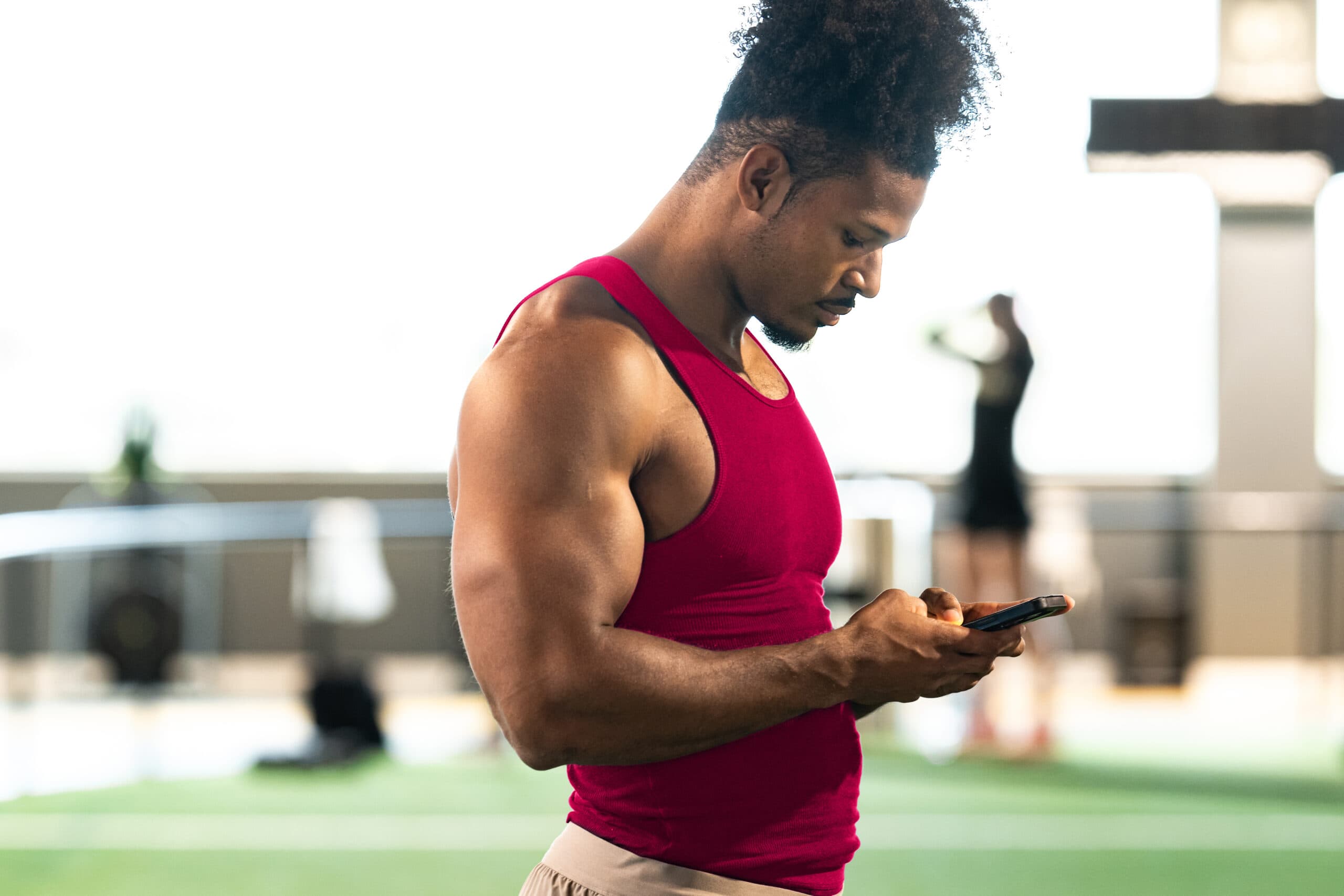 Fitness club manager reviewing analytics dashboard on laptop