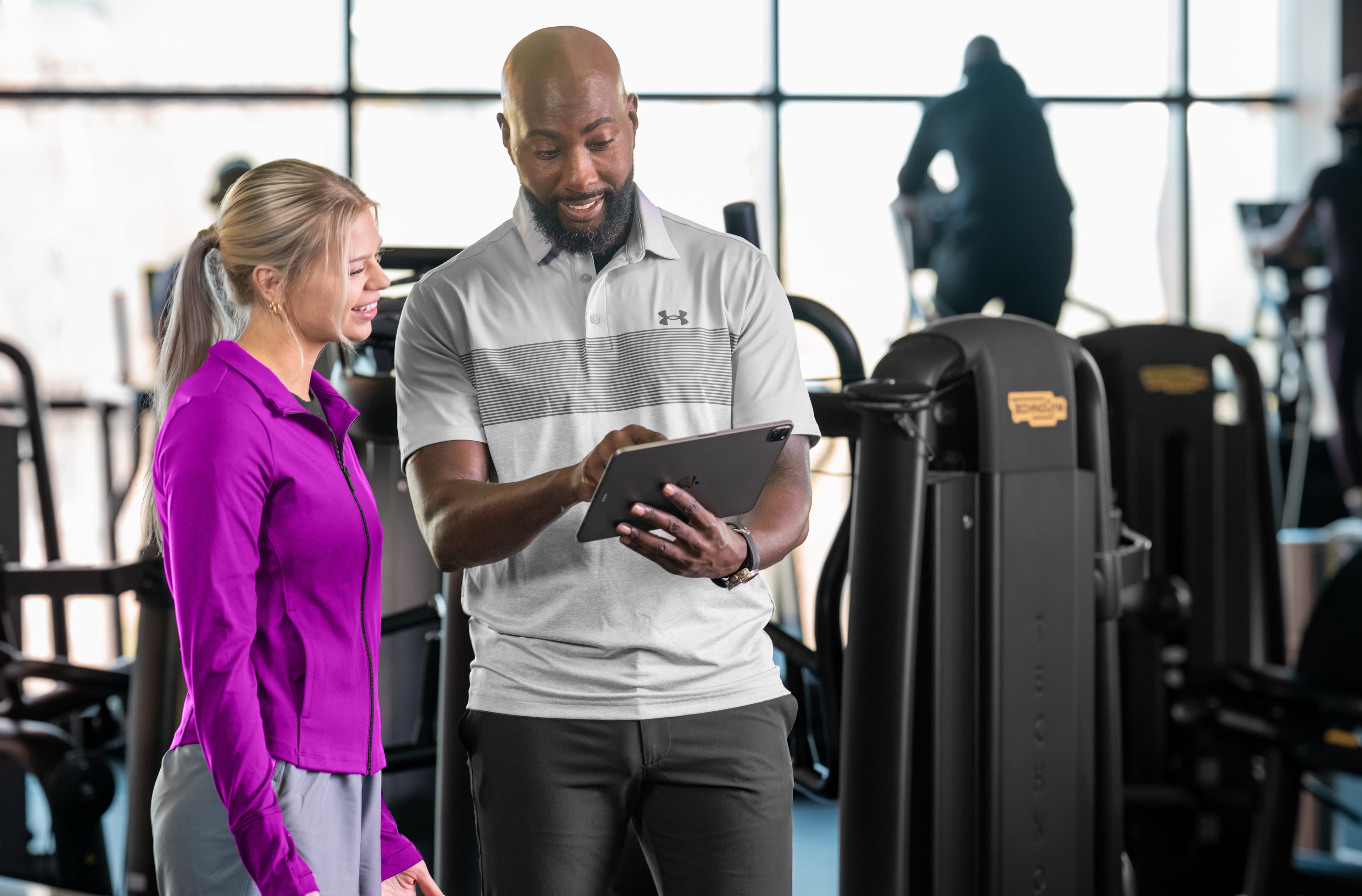 A tennis coach tracking student details using management software