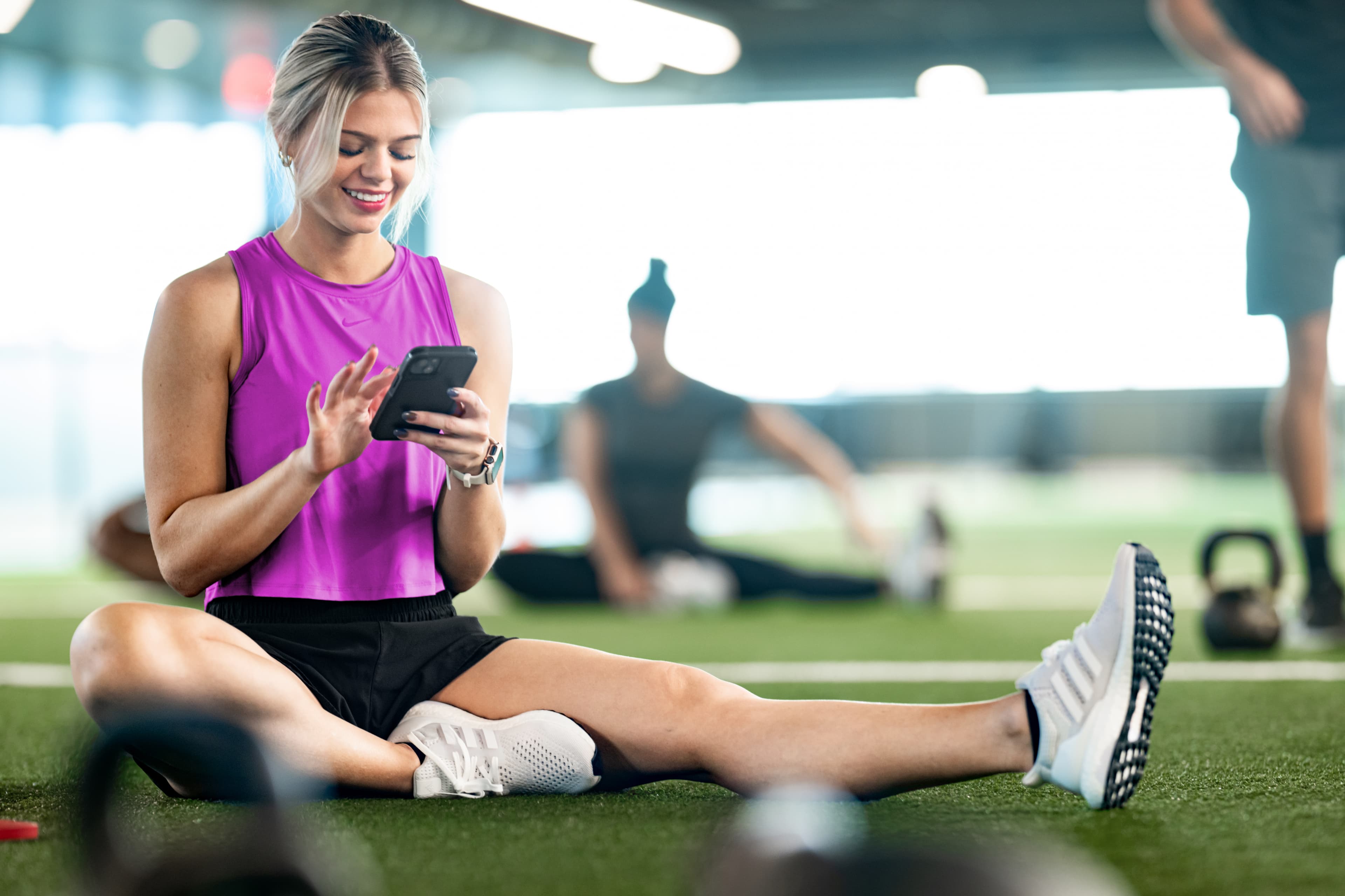 A woman using billing software automating payments and renewals for fitness clubs