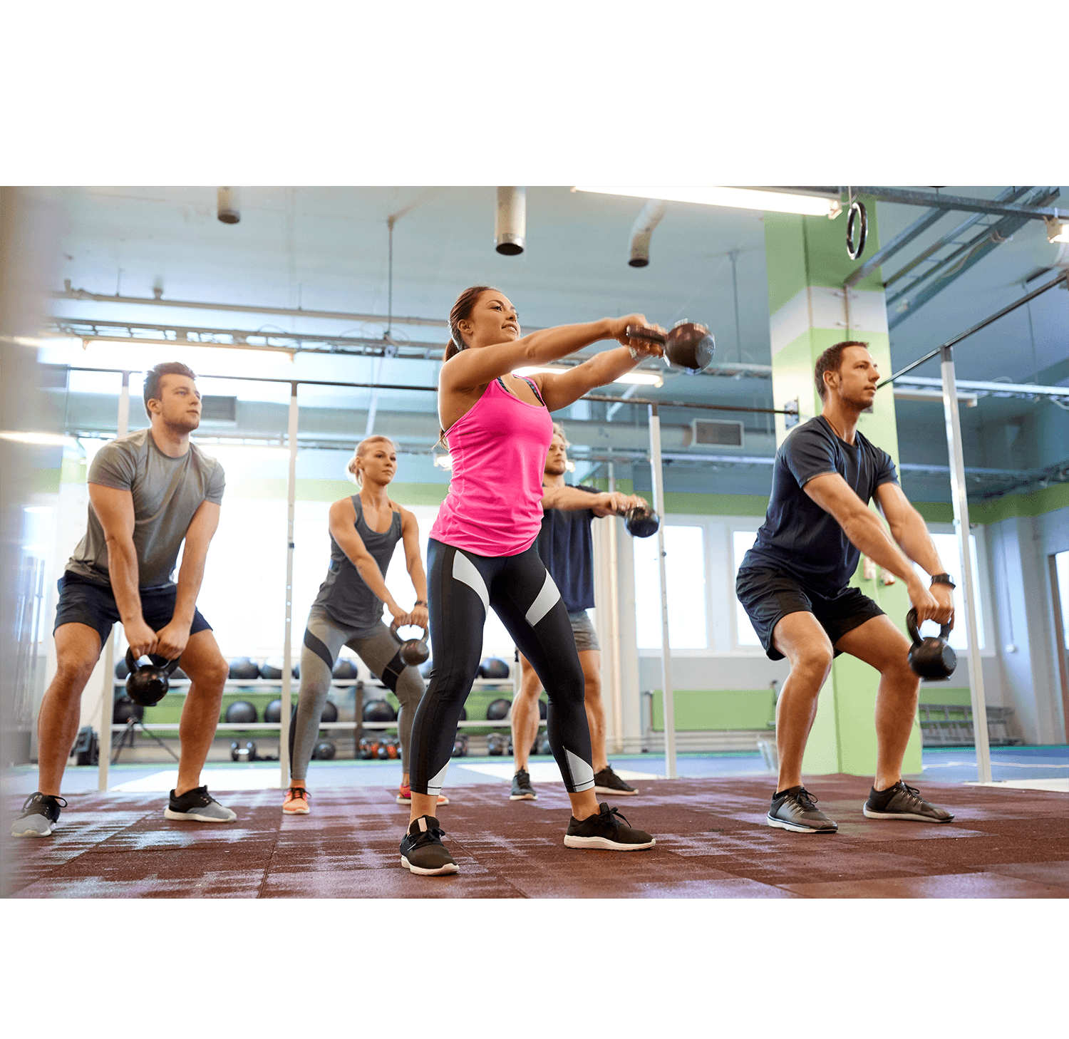 Trainer coaching a small group training session in a health club to improve member engagement and retention
