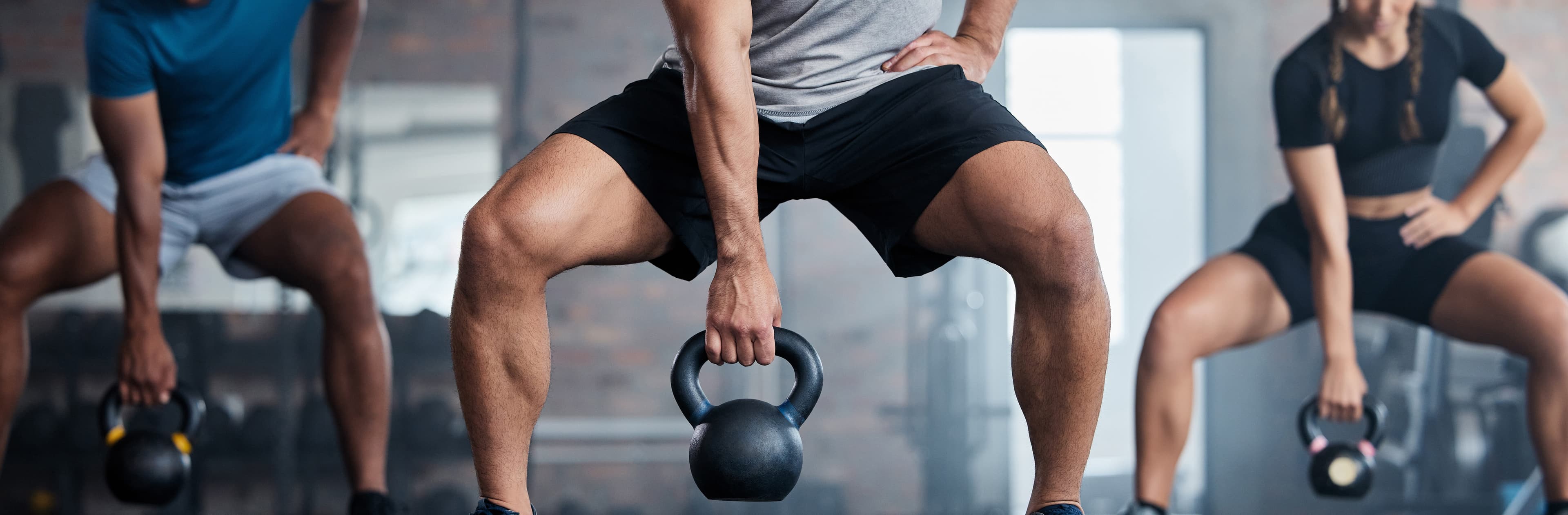 poeple working out with kettlebells