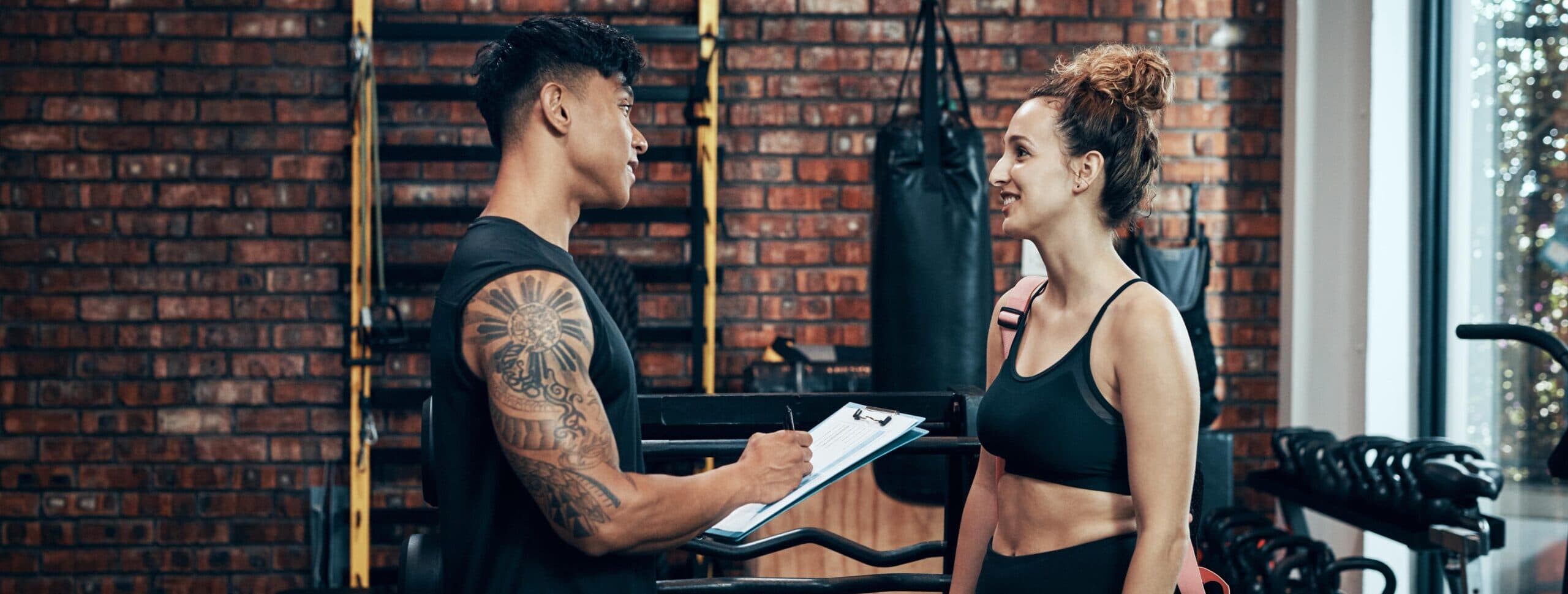 two people discussing at a fitness club