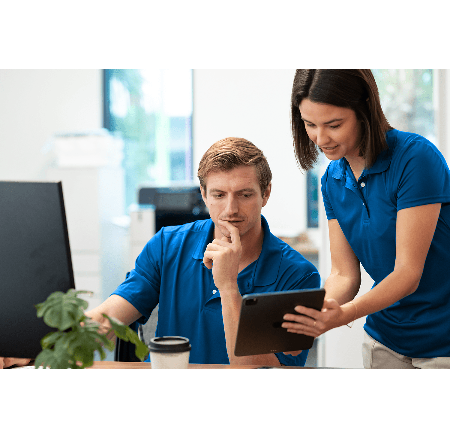 Fitness club operator reviewing financial reporting dashboard showing revenue, expenses, and member trends