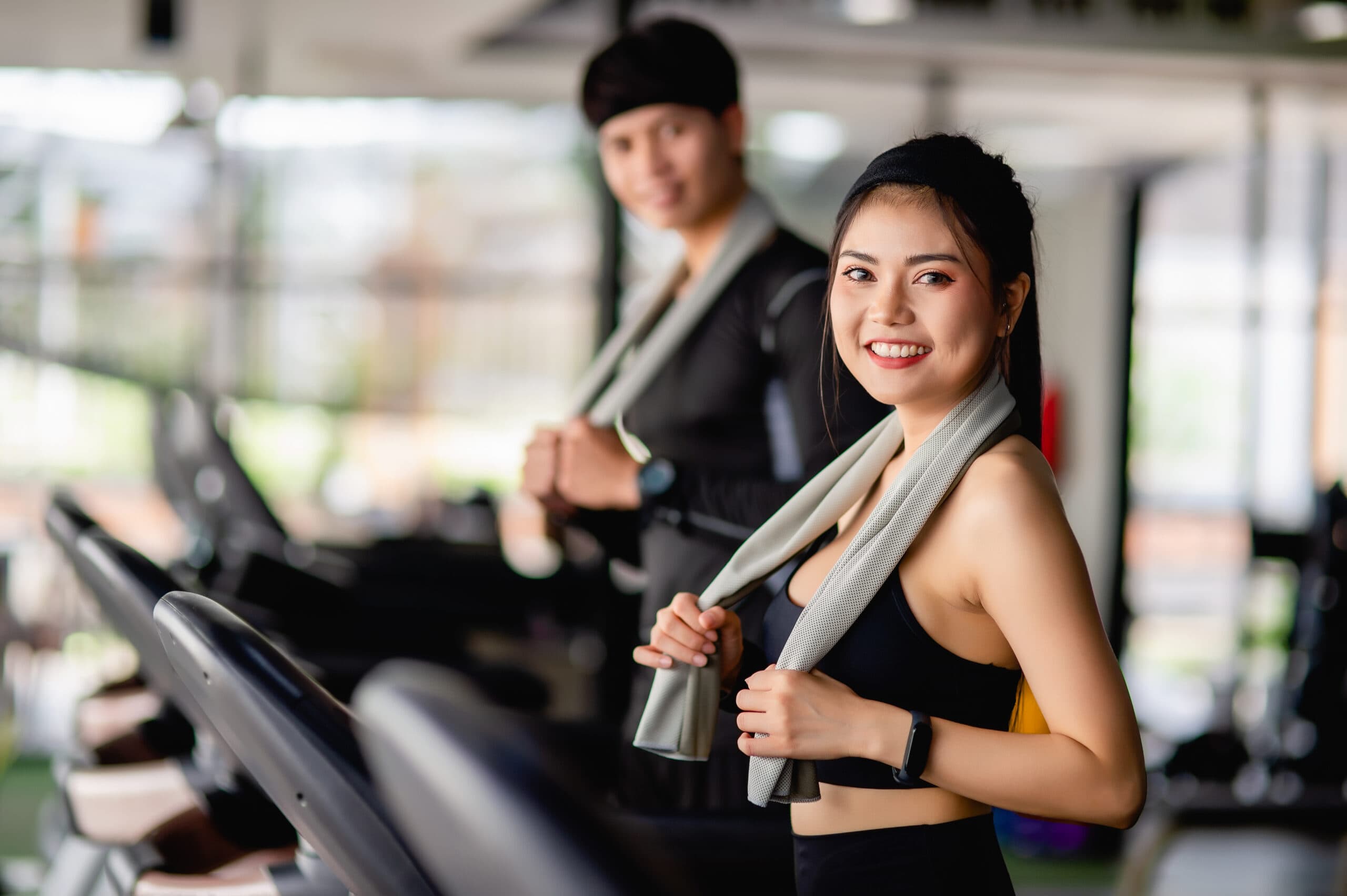 People enjoying a workout session at a modern health club