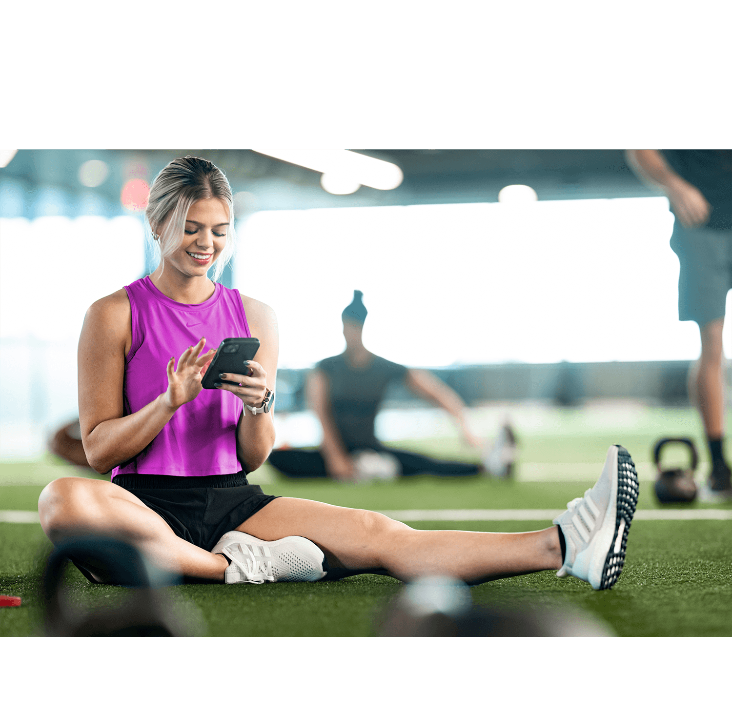 Fitness staff and members using the new Daxko Club Automation mobile app to manage schedules and bookings