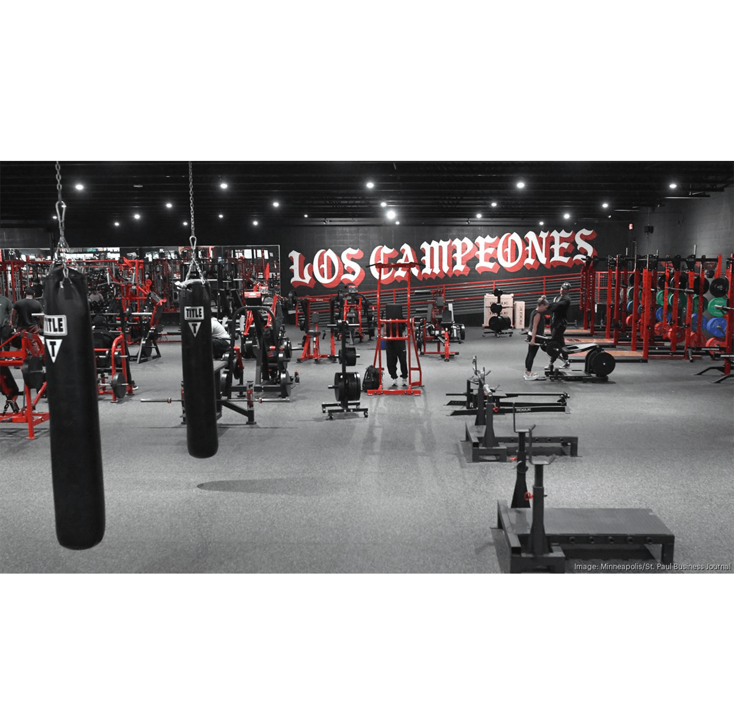 Los Campeones Gym team reviewing member data on Club Automation dashboard at their flagship fitness center