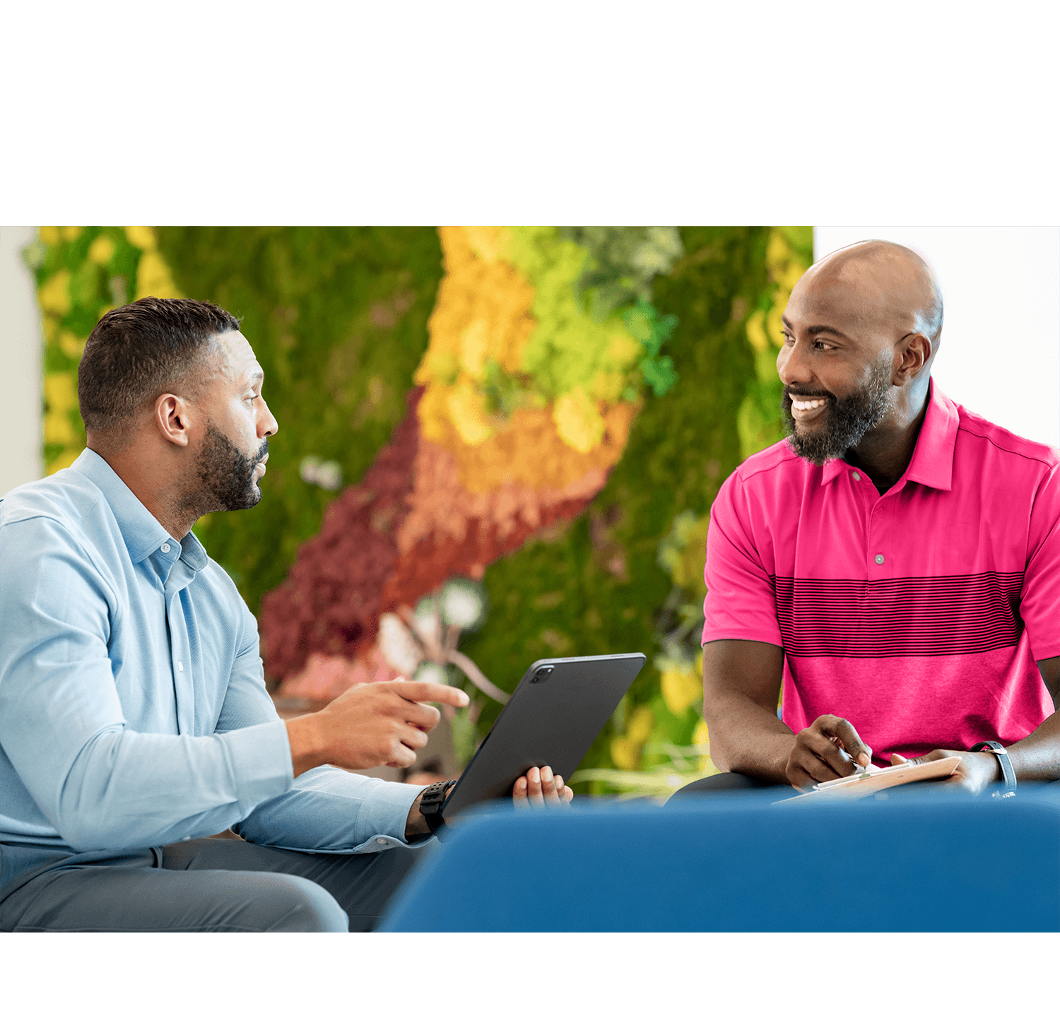 Health club manager reviewing a gym CRM evaluation checklist on a laptop showing Club Automation and Daxko Engage Pro features during a software buying decision